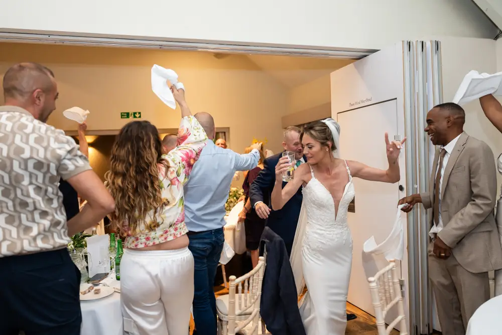 Stoke Place wedding photographer. Bride and groom arriving for wedding breakfast.