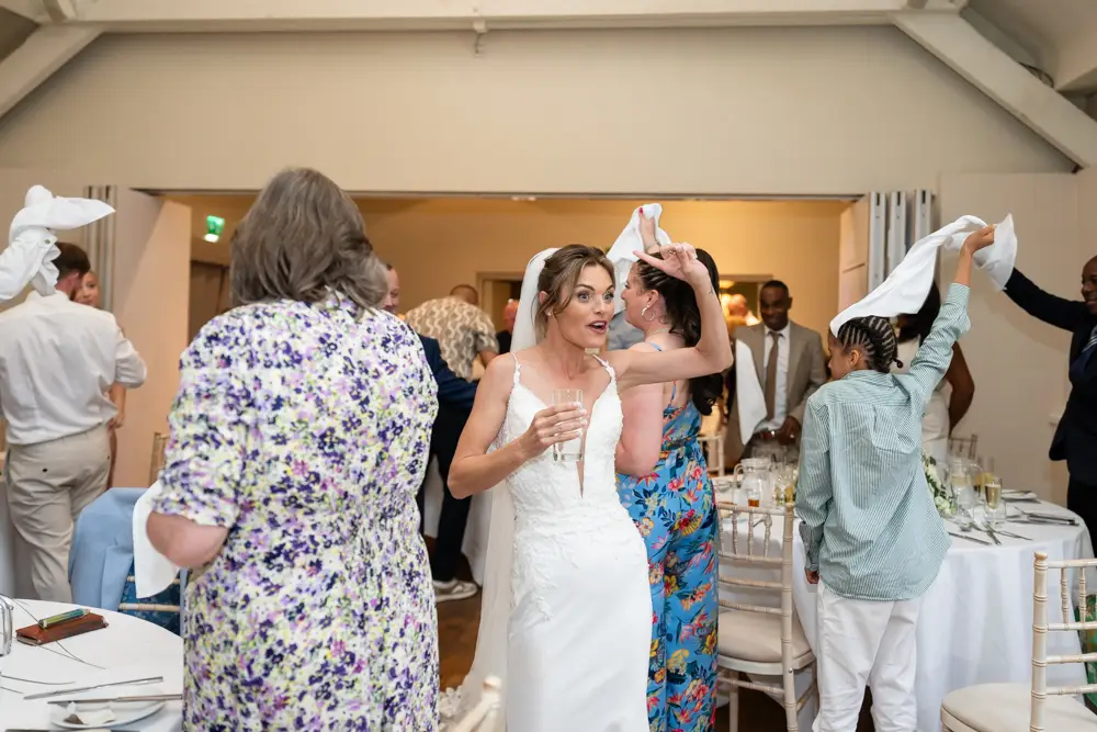 Stoke Place wedding photographer. Bride and groom arriving for wedding breakfast.