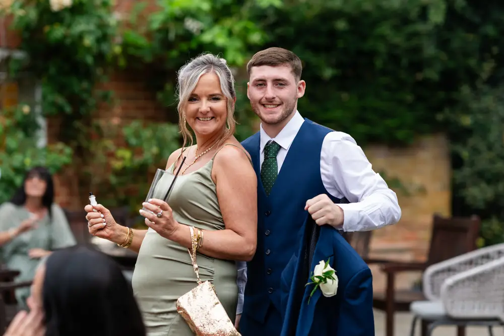 Stoke Place wedding photographer. guests in garden