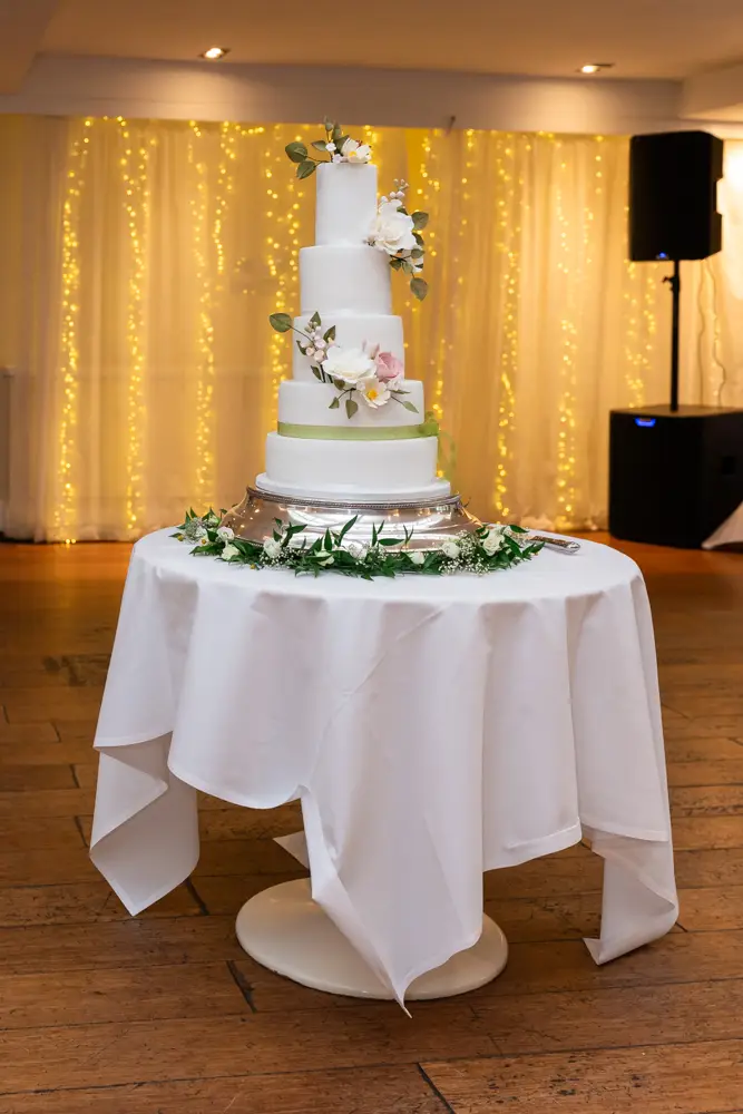 Stoke Place wedding photographer. wedding cake set up for cutting by bride and groom