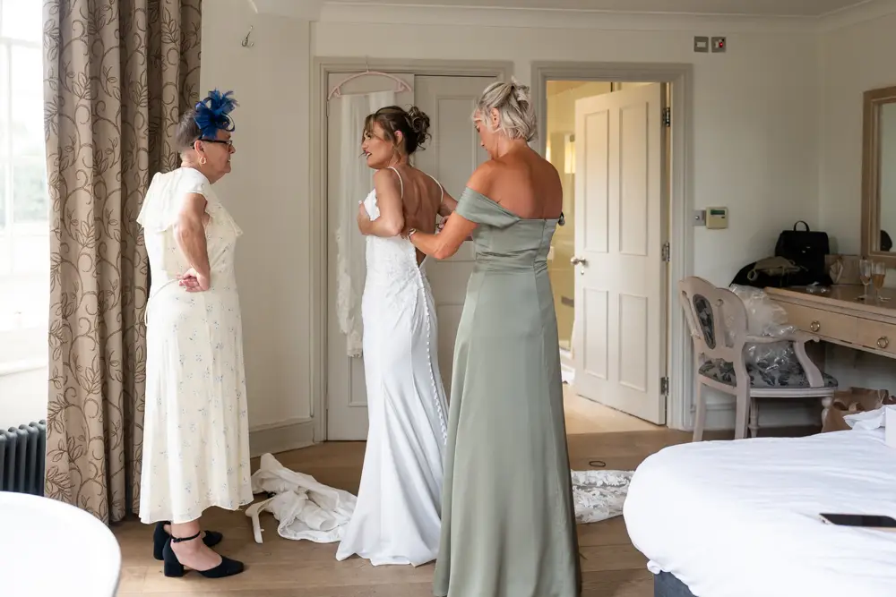 Stoke Place wedding photographer. Bride getting ready in Alexandra suite.