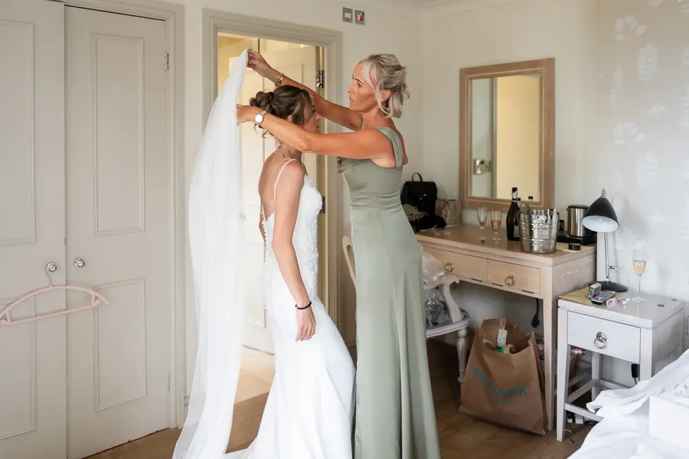 Stoke Place wedding photographer. Bride getting ready in Alexandra suite.