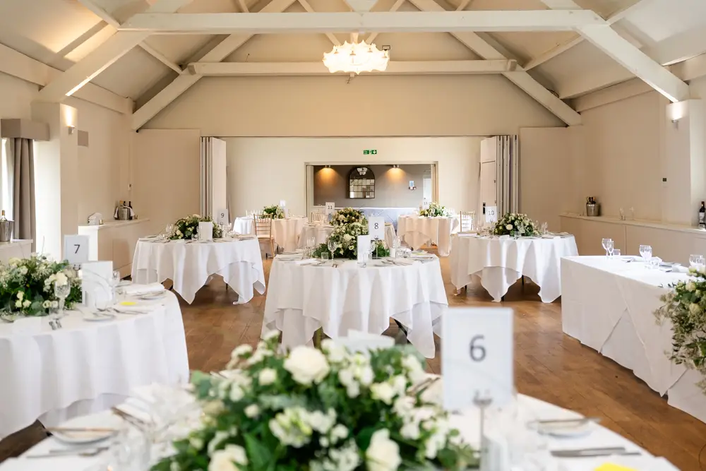 Stoke Place wedding photographer. Wedding breakfast room setup.