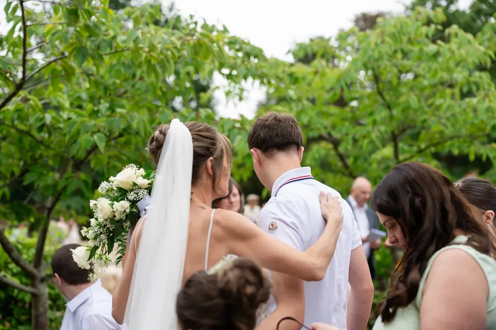 Stoke Place wedding photographer. Bride with guests.