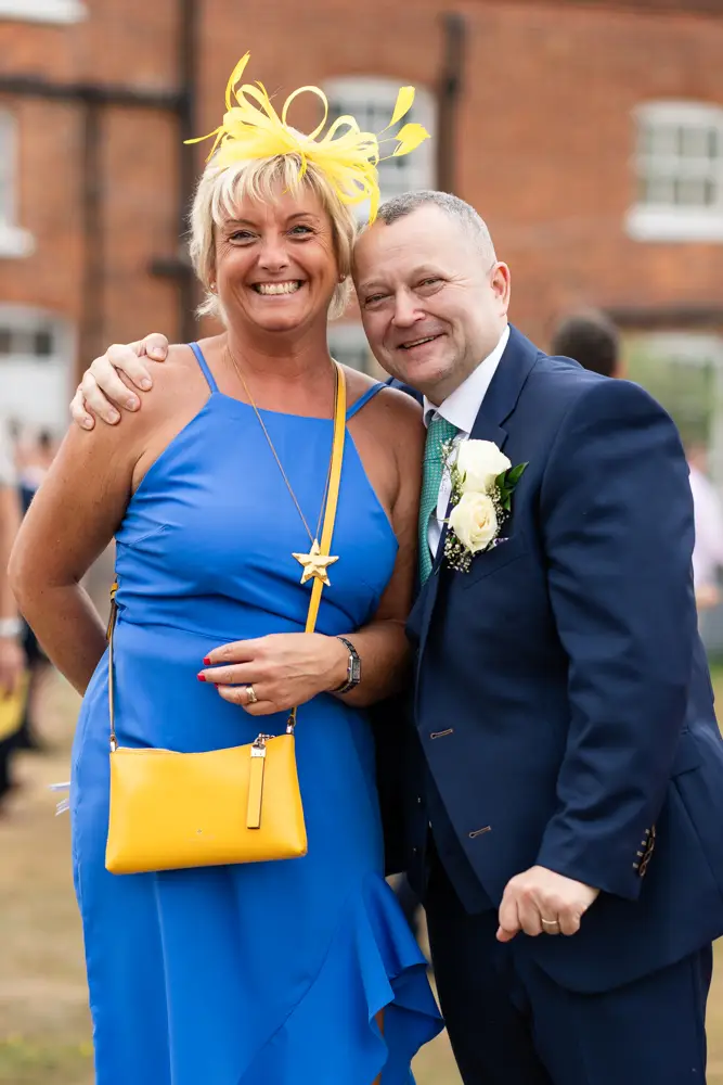 Stoke Place wedding photographer. Groom with guest.