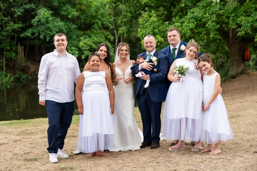 Stoke Place wedding photographer. Bride and groom with family