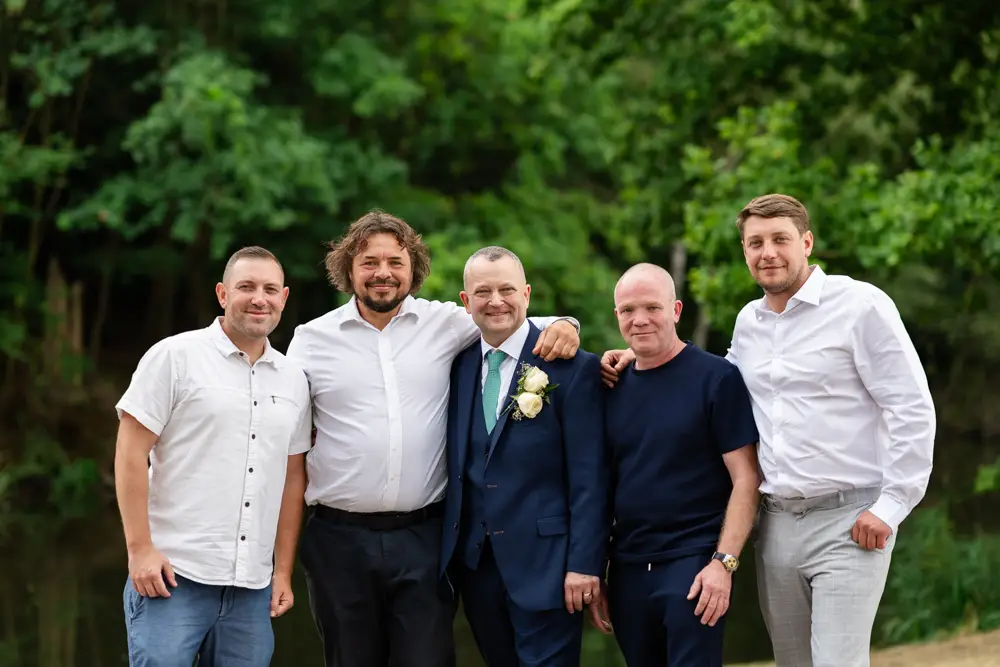 Stoke Place wedding photographer. Groom with friends.