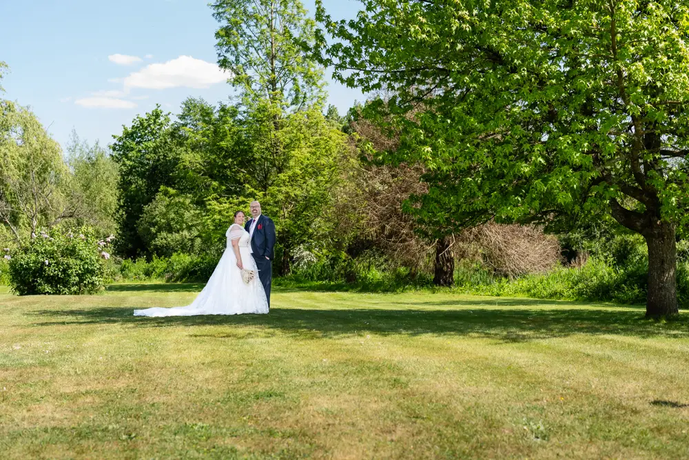 The Old Mill wedding photographer. bride and groom in fairy light tunnel at twilight.