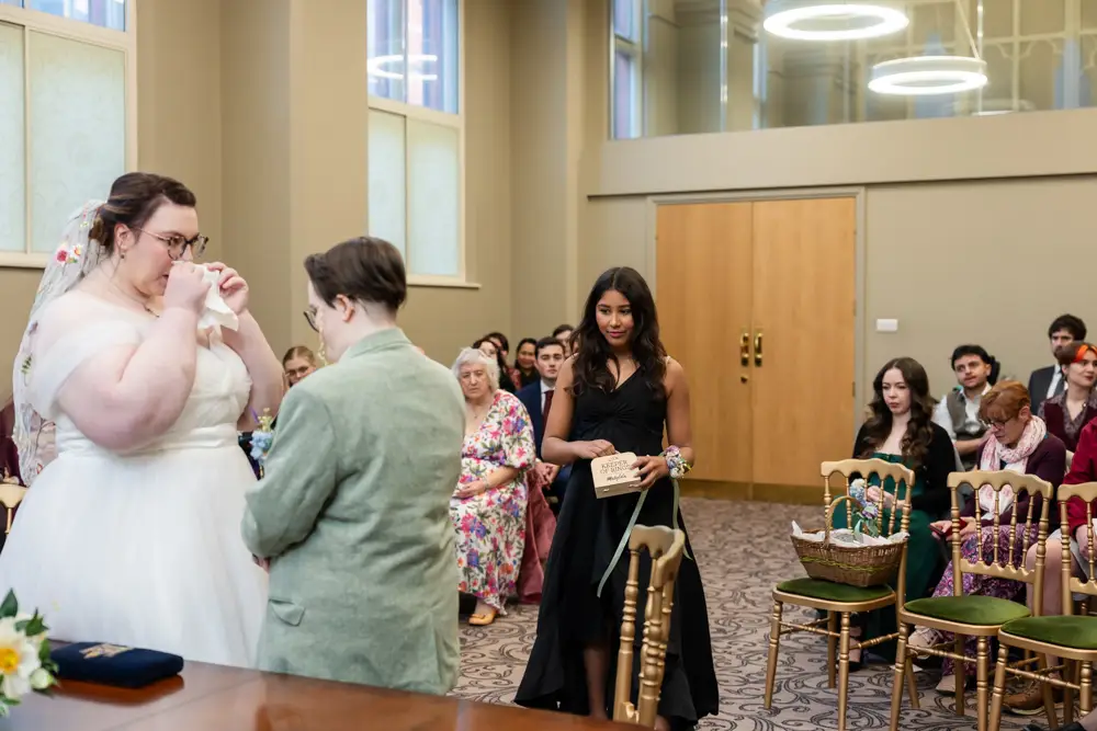 Reading Town Hall wedding photographer. Couple exchange rings during ceremony at the town hall.