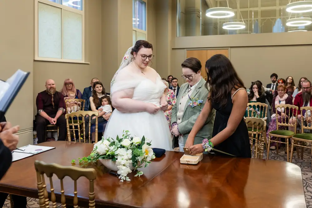 Reading Town Hall wedding photographer. Couple exchange rings during ceremony at the town hall.