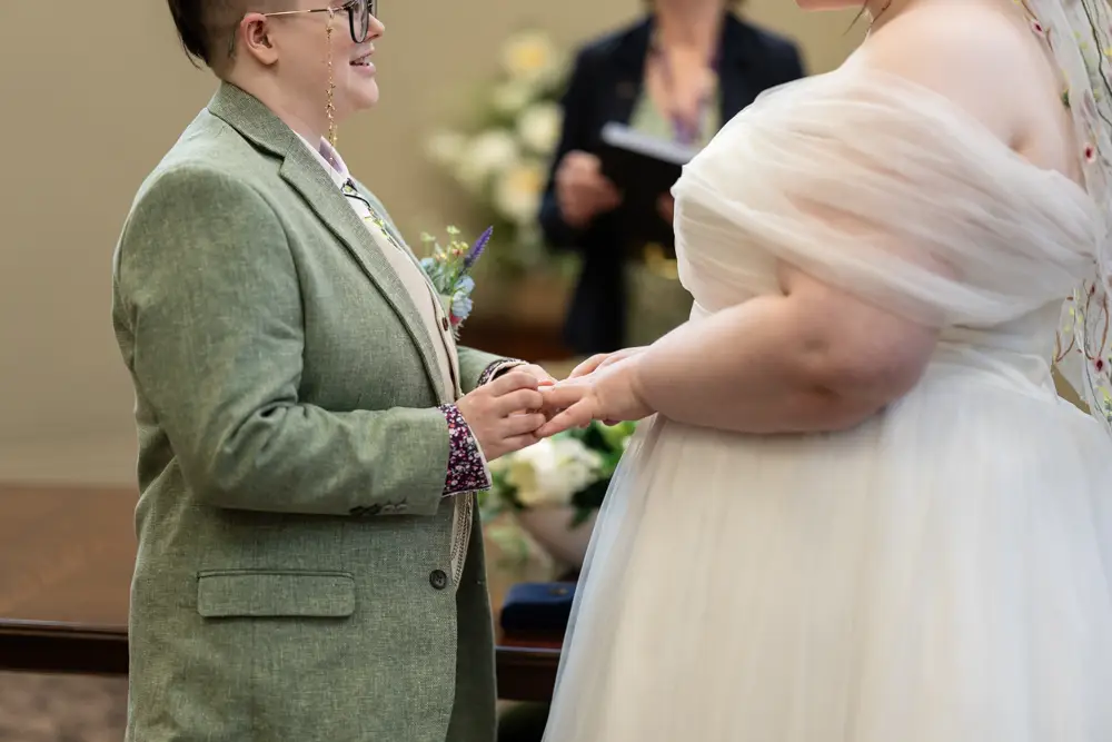 Reading Town Hall wedding photographer. Couple exchange rings during ceremony at the town hall.