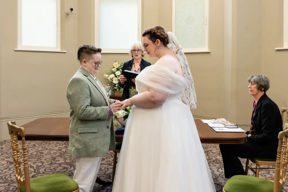 Reading Town Hall wedding photographer. Couple exchange rings during ceremony at the town hall.