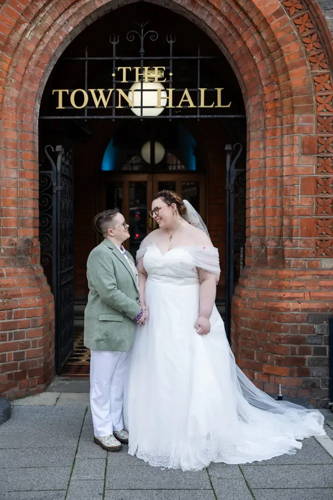 Reading Town Hall wedding photographer. Newlyweds outside the old town hall entrance.
