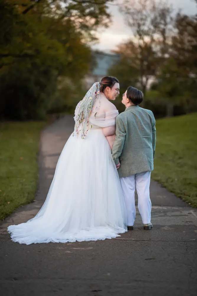 Same sex wedding photographer. Newlyweds in Woodford park after Reading town hall wedding.
