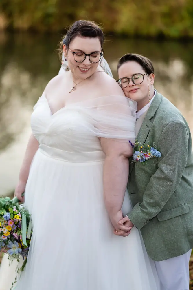 Same sex wedding photographer. Newlyweds in Woodford park after Reading town hall wedding.