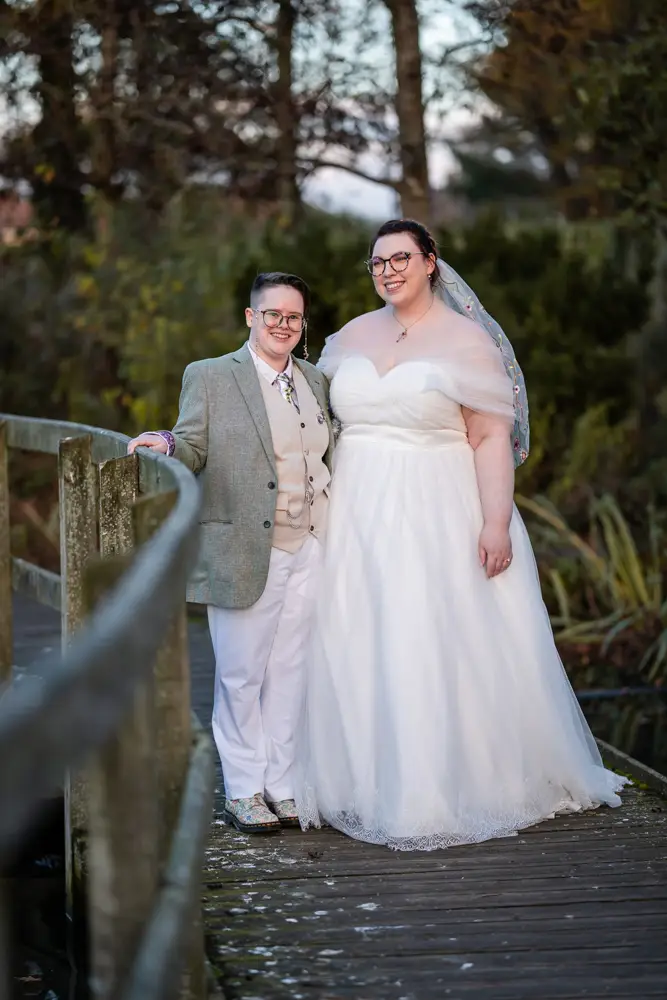 Same sex wedding photographer. Newlyweds in Woodford park after Reading town hall wedding.