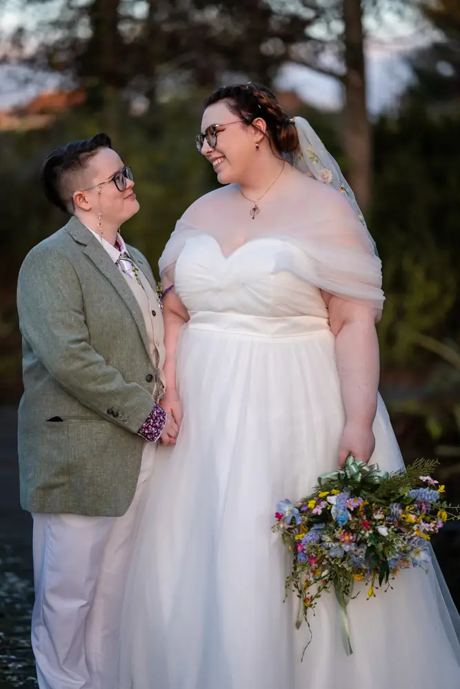 Same sex wedding photographer. Newlyweds in Woodford park after Reading town hall wedding.