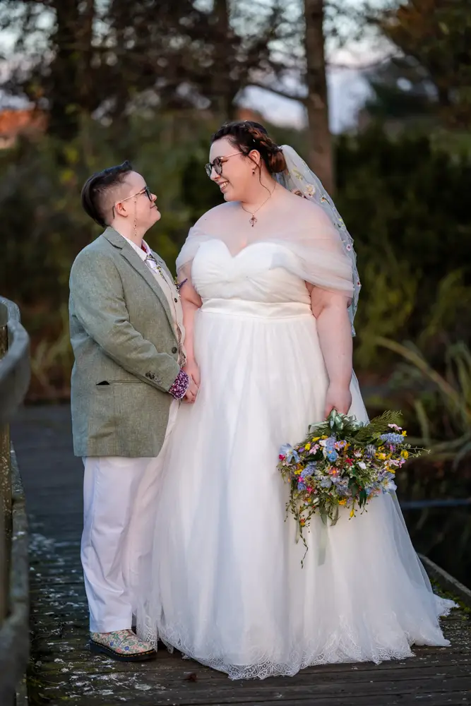 Same sex wedding photographer. Newlyweds in Woodford park after Reading town hall wedding.