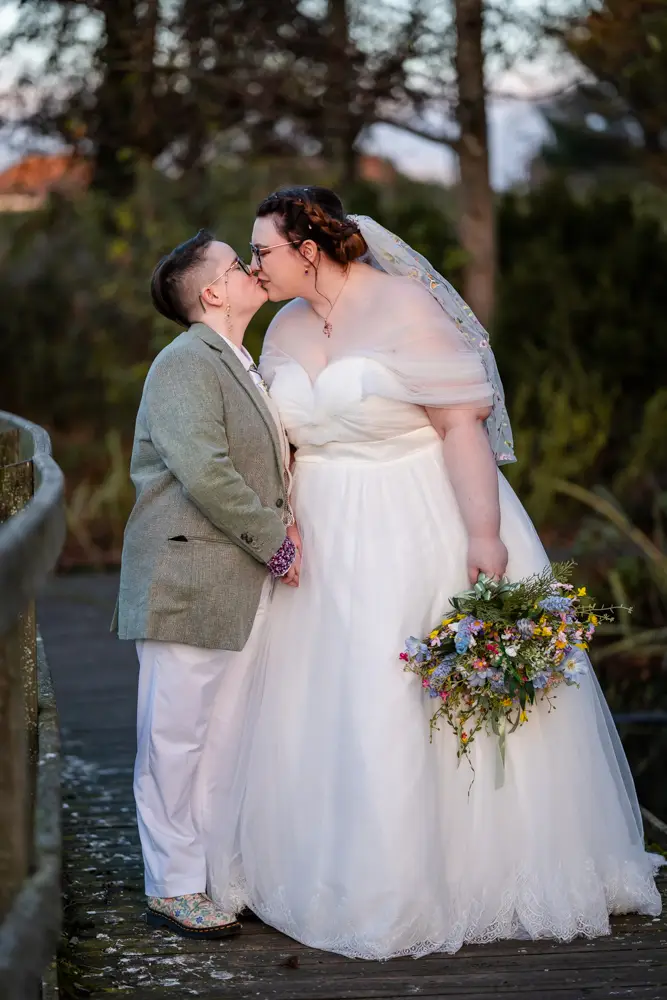 Same sex wedding photographer. Newlyweds in Woodford park after Reading town hall wedding.