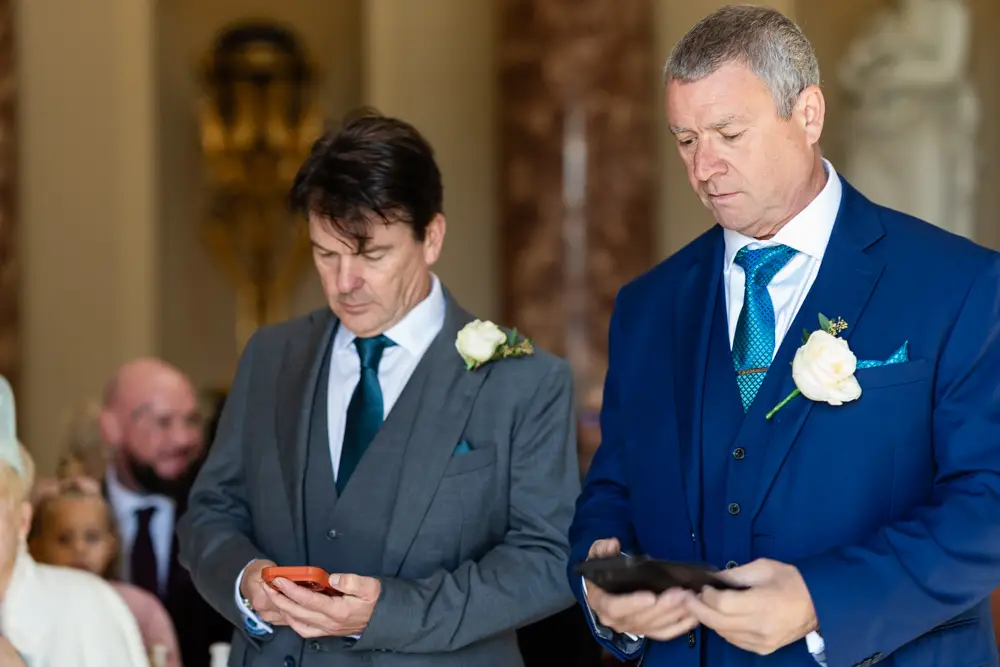 Stowe House wedding photographer. Groom awaits arrival of bride