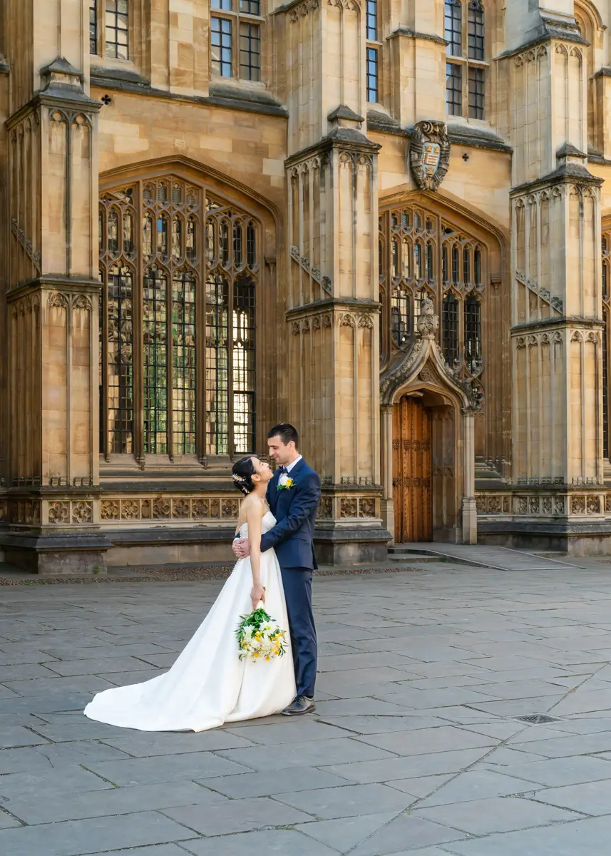 Bride and groom in front of Wren Door at the Bodleian Library. Oxford wedding photographer.