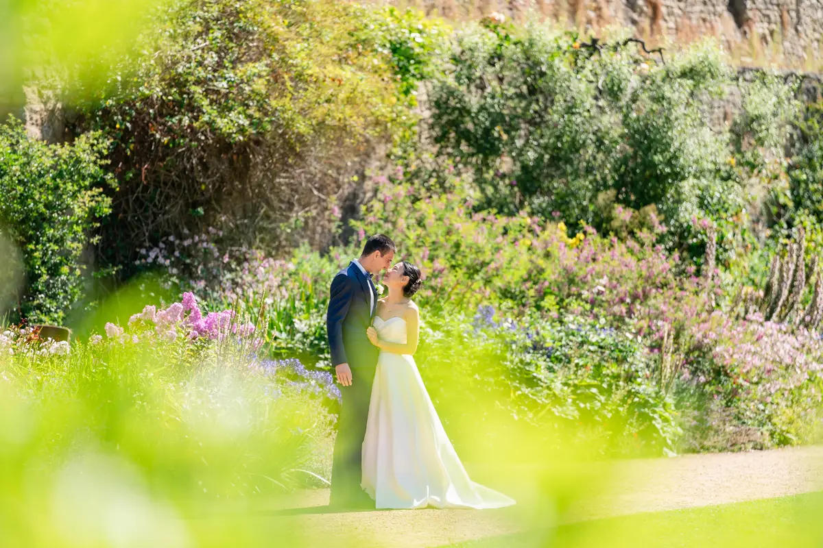 Oxford wedding photographer. Bride and groom on wedding day in the gardens of New College Oxford.