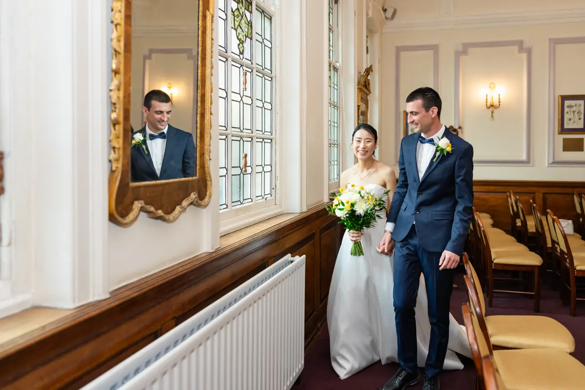 Bride and groom leaving ceremony room at Oxford Registration office. Oxford wedding photographer.
