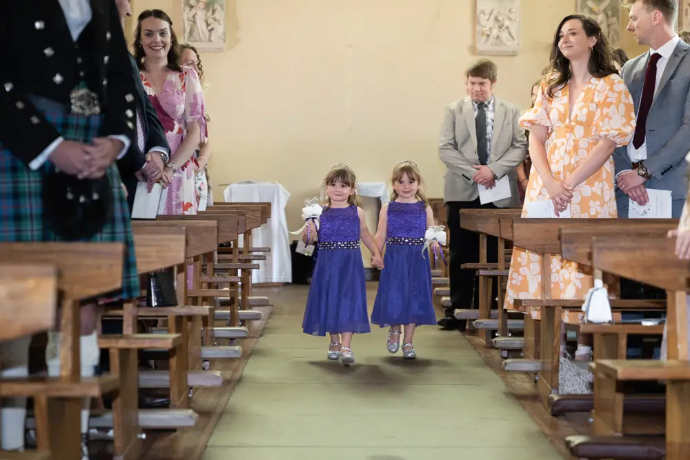 Oxfordshire Wedding Photographer. Flower girls arriving for ceremony at Our Lady and St Edmund's church in Abingdon.