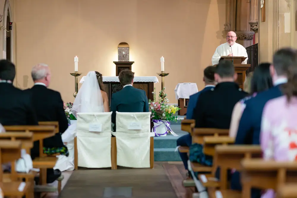 Oxfordshire Wedding Photographer. Bride and groom during ceremony at Our Lady and St Edmund's church in Abingdon.