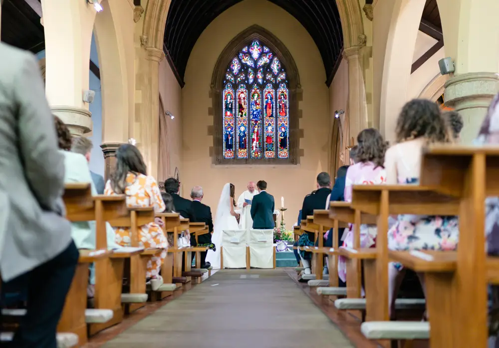 Oxfordshire Wedding Photographer. Bride and groom during ceremony at Our Lady and St Edmund's church in Abingdon.