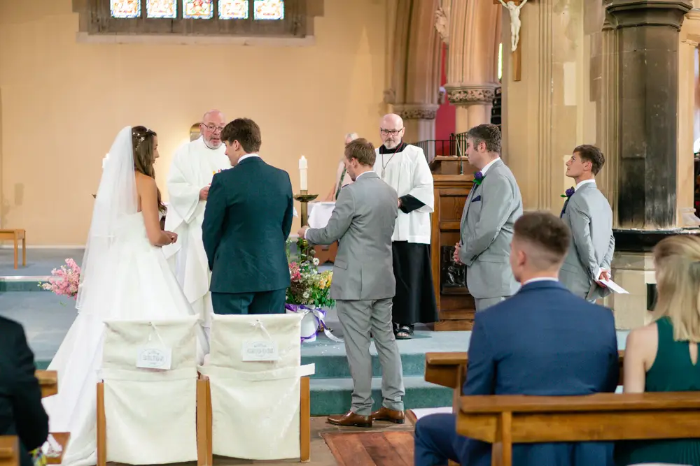 Oxfordshire Wedding Photographer. Bride and groom during ceremony at Our Lady and St Edmund's church in Abingdon.