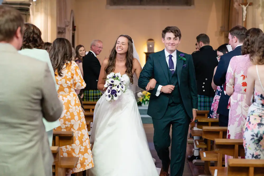 Oxfordshire Wedding Photographer. Bride and groom leaving ceremony at Our Lady and St Edmund's church in Abingdon.