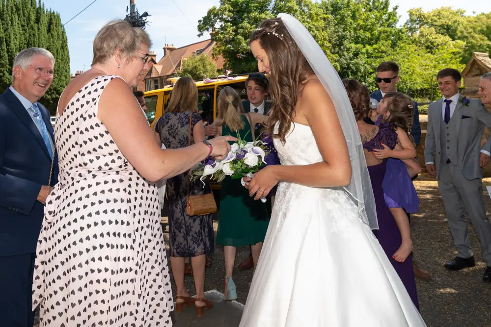 Oxfordshire Wedding Photographer. Guests outside Our Lady and St Edmund's church in Abingdon.