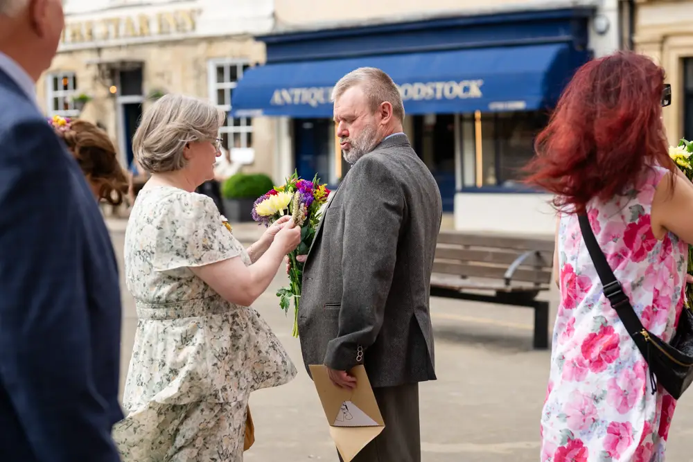 Guests preparing for wedding at Woodstock Town Hall in Oxfordshire