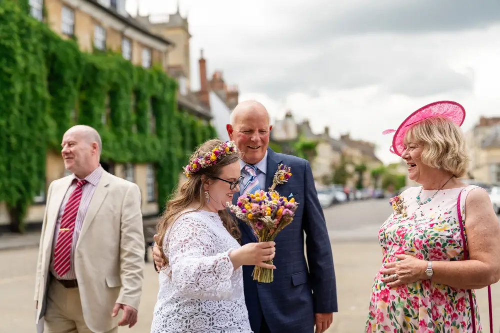 Bride with family before wedding ceremony at Woodstock Town Hall in Oxfordshire