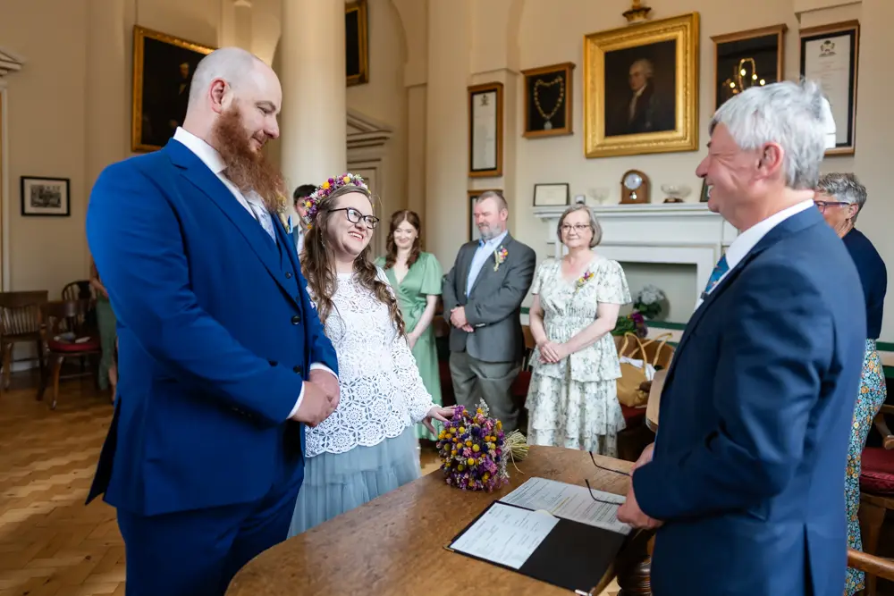 Bride and groom during ceremony at Woodstock Town Hall in Oxfordshire