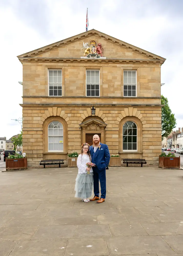 Woodstock wedding photographer. Bride and groom outside Woodstock Town Hall in Oxfordshire.