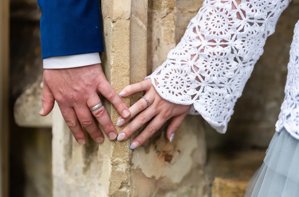 Woodstock wedding photographer. Bride and groom show off new wedding rings.