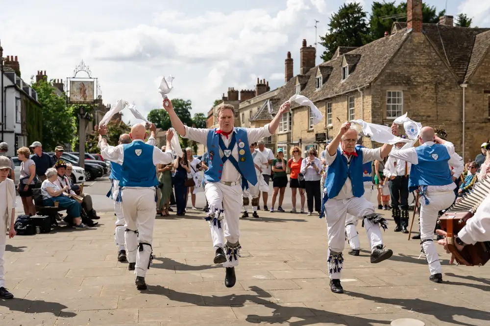 Morris dancers outside Woodstock Town Hall in Oxfordshire.
