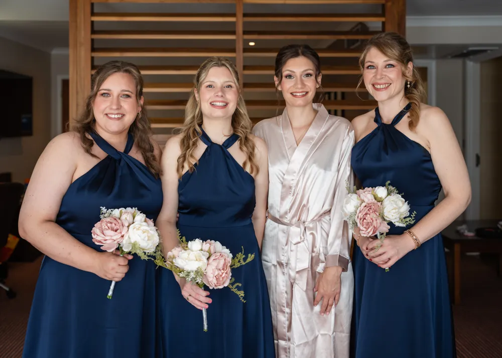 Bride with bridesmaids. Bull Hotel bridal prep.