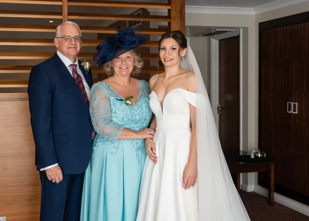Bride with mum and dad before wedding ceremony. Bull Hotel bridal prep.