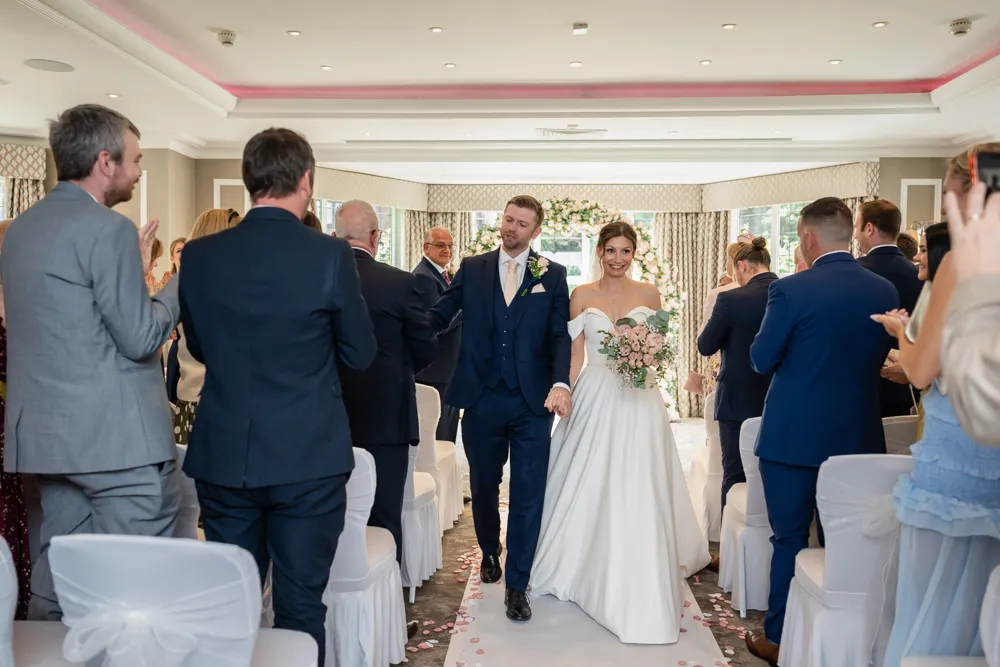Bride and groom leaving their Bull Hotel wedding ceremony.