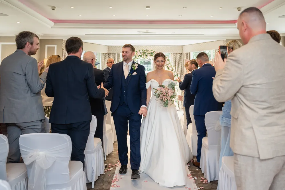 Bride and groom leaving their Bull Hotel wedding ceremony.