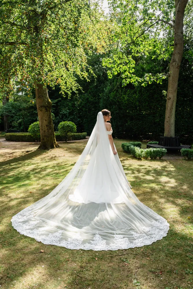 Bride in the gardens of The Bull Hotel in Gerrards Cross. Bull Hotel Wedding Photographer.