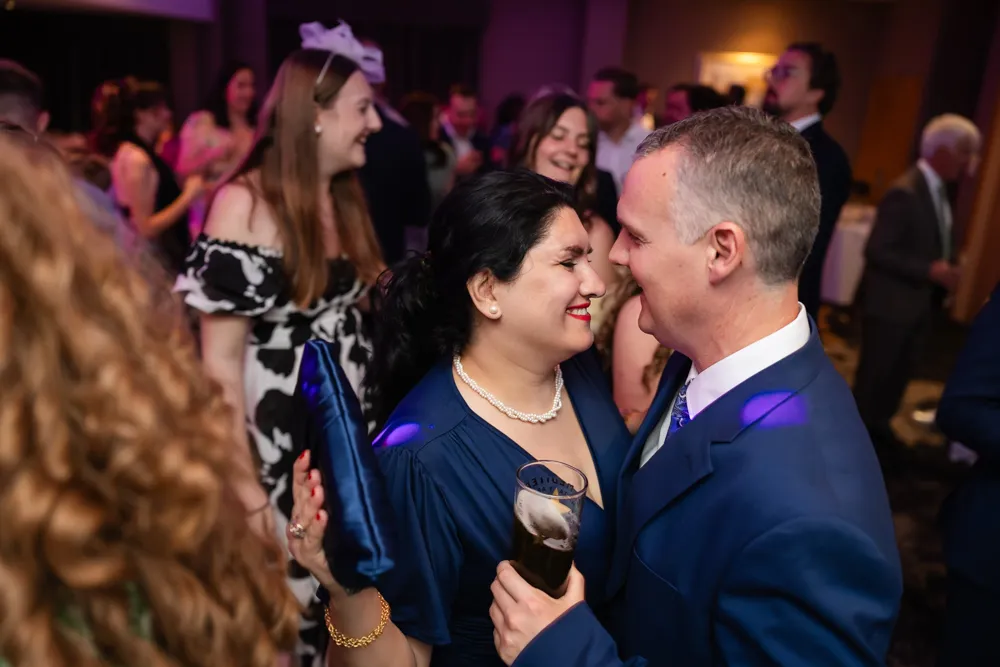 Guests dancing in Thames Suite. Bull Hotel Wedding Photographer.