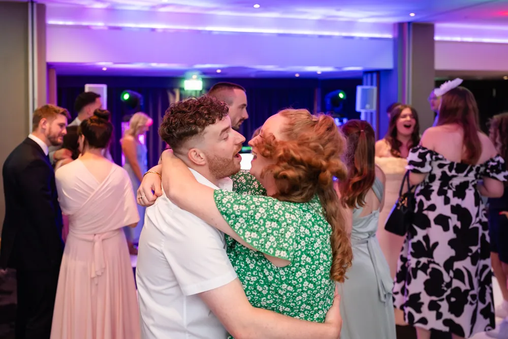 Guests dancing in Thames Suite. Bull Hotel Wedding Photographer.