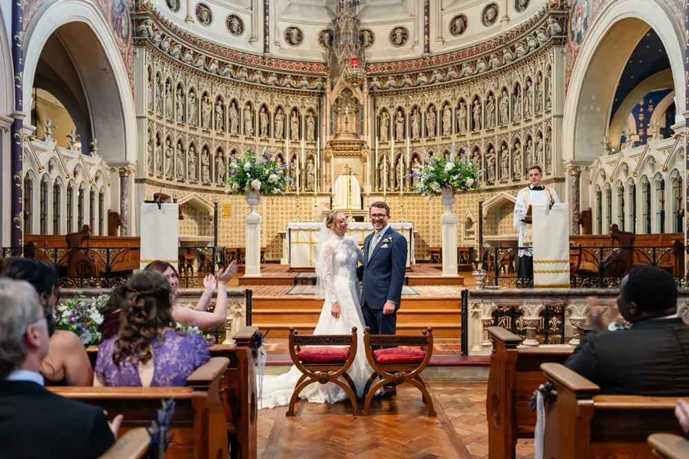Oxford Oratory wedding photographer. Bride and groom during wedding ceremony.