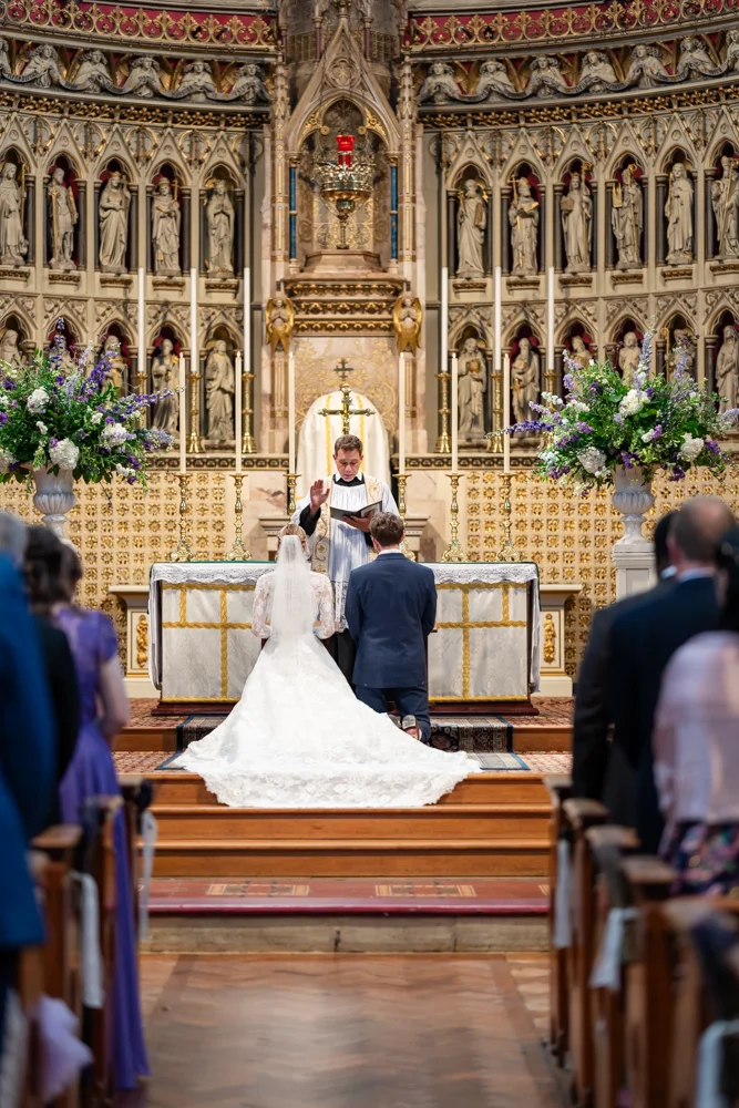 Oxford Oratory wedding photographer. Bride and groom during wedding ceremony.