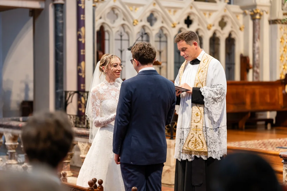 Oxford Oratory wedding photographer. Bride and groom during wedding ceremony.