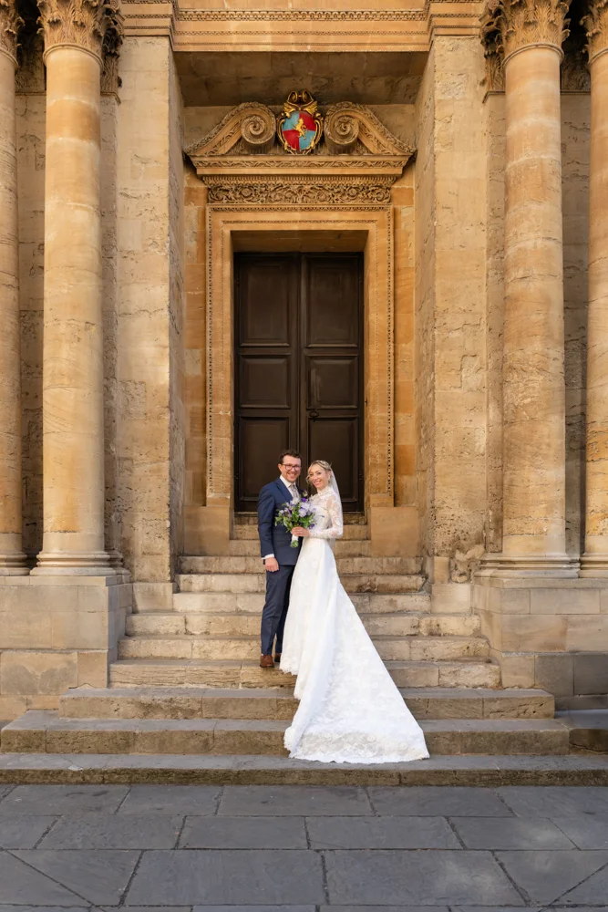 Oxford University wedding photographer. Bride and groom on steps of the History of Science Museum.